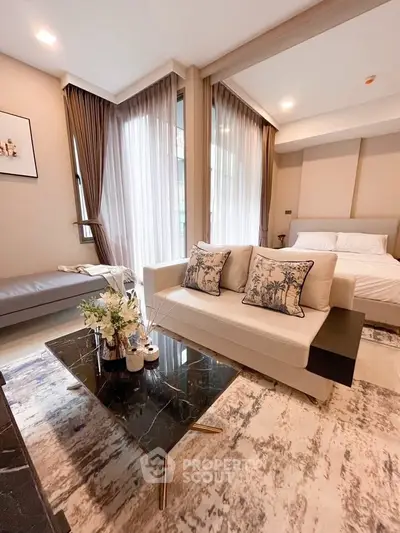 Luxurious modern bedroom with elegant decor and large windows for natural light.