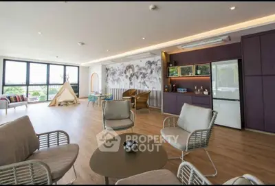 Spacious modern living room with large windows and stylish decor
