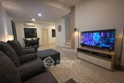 Modern living room with cozy sofa and entertainment setup
