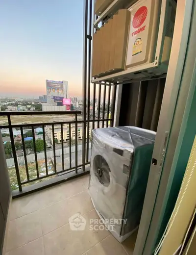 High-rise balcony with city view and washing machine, perfect for urban living.
