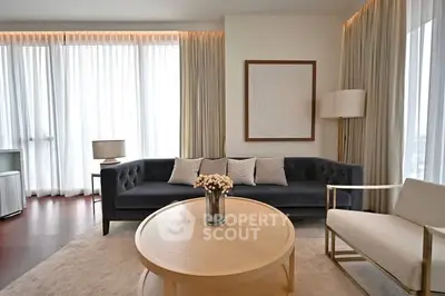 Elegant living room with modern furniture and large windows