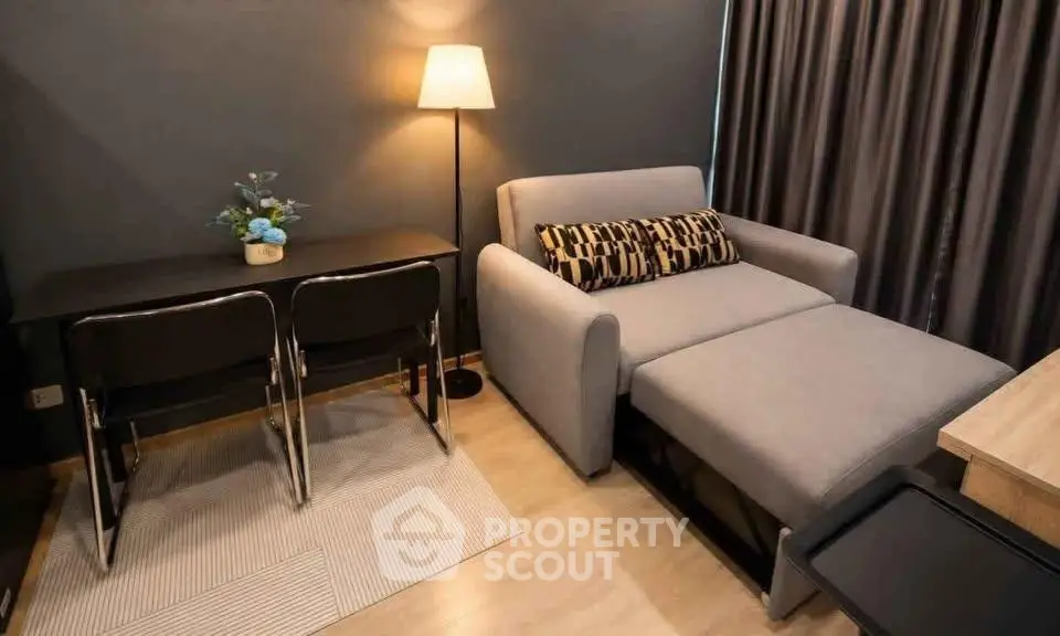 Cozy living room with modern sofa and dining area in stylish apartment