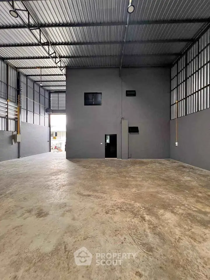 Spacious industrial warehouse with high ceilings and ample natural light