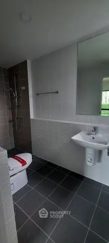 Modern bathroom with sleek tiles and contemporary fixtures
