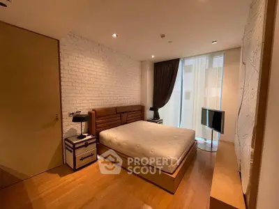 Spacious modern bedroom with stylish decor and natural light