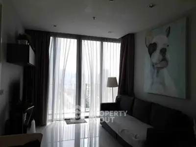 Modern living room with large windows and stylish dog artwork
