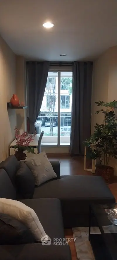 Cozy living room with modern decor and large window view