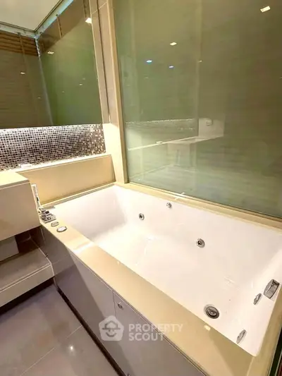 Luxurious bathroom with a modern bathtub and elegant design features.