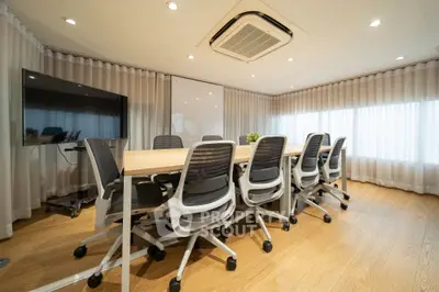 Modern conference room with sleek design and ample natural light