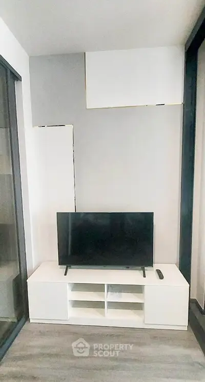 Modern living room with sleek TV unit and minimalist decor