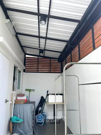 Modern utility area with sleek roof and organized storage space