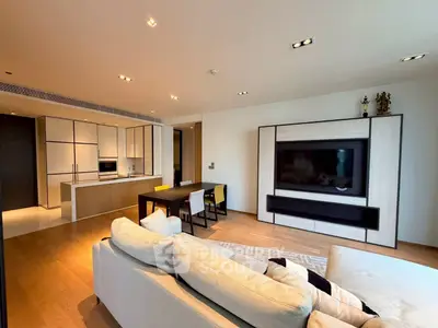 Spacious modern living room with open kitchen and stylish decor