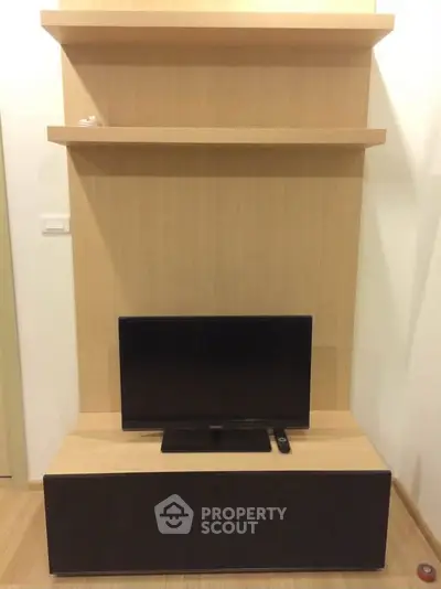 Modern living room with sleek TV stand and minimalist shelving