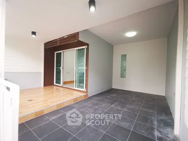 Modern patio with sliding glass doors and stylish tile flooring