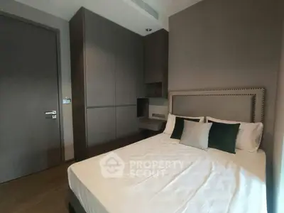 Modern bedroom with stylish decor and built-in wardrobe