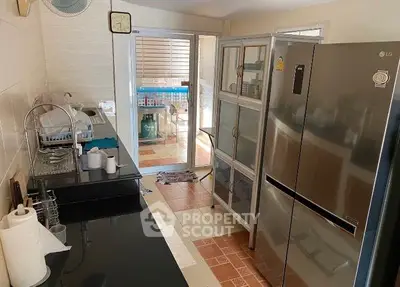 Modern kitchen with sleek appliances and ample storage space
