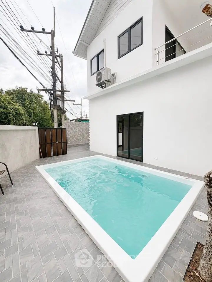Modern home exterior with private pool and sleek design