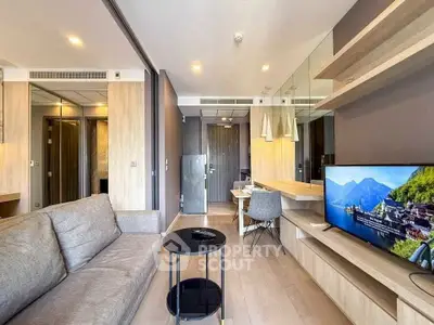 Modern living room with sleek furniture and wall-mounted TV, perfect for urban living.