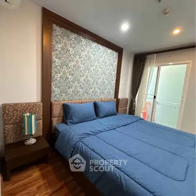 Cozy bedroom with elegant decor and balcony access in modern apartment