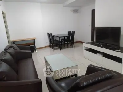 Spacious living room with modern furniture and entertainment setup