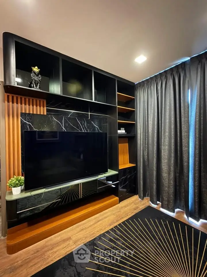Luxurious living room with modern entertainment center and elegant decor