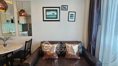 Stylish living room with modern decor and cozy seating in a contemporary apartment.