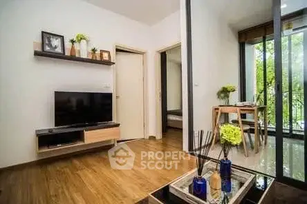 Modern living room with wooden flooring and balcony view
