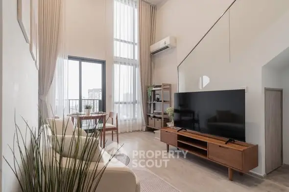 Modern living room with high ceilings and stylish decor