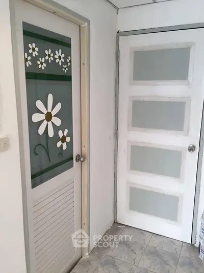 Charming interior doors with floral design in a cozy home setting.