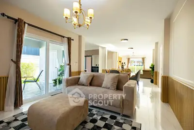 Spacious living room with modern decor and natural light