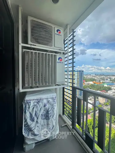 High-rise balcony with air conditioning units and cityscape view