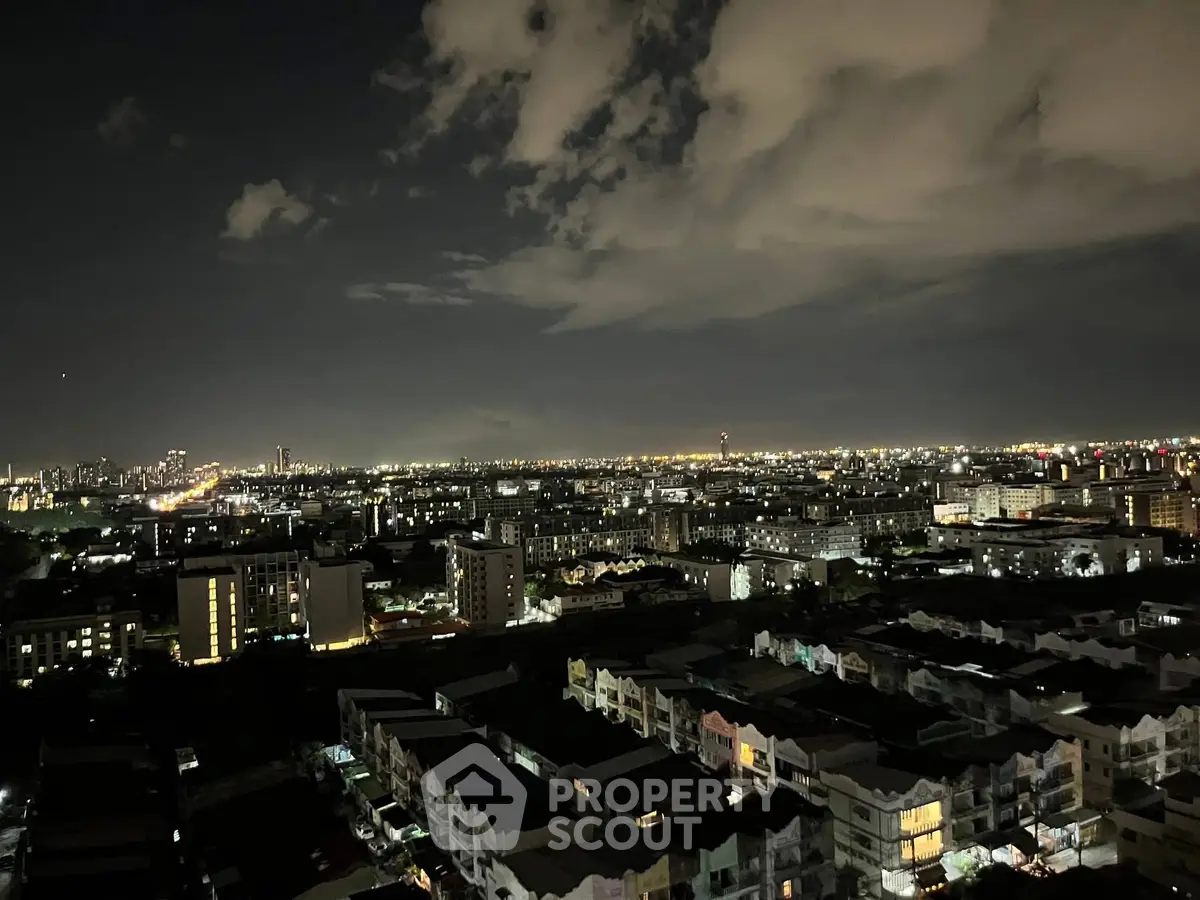 Stunning cityscape night view with illuminated skyline and sprawling urban landscape.