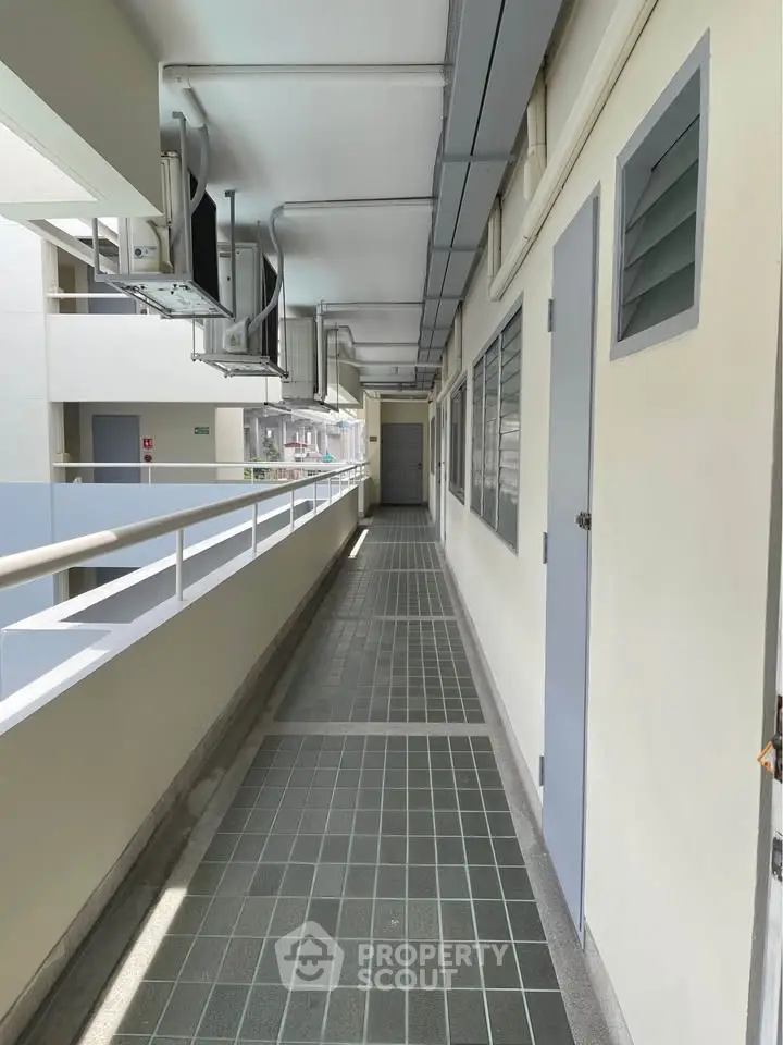 Modern apartment corridor with sleek design and natural lighting