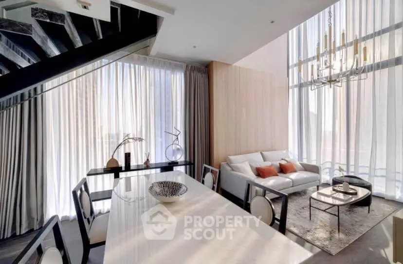 Luxurious modern living room with high ceilings and elegant decor