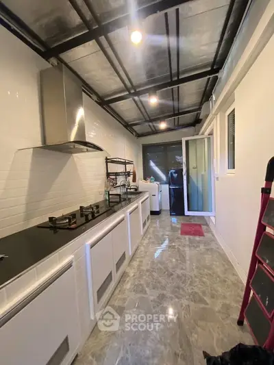 Modern kitchen with sleek design and gas stove in a stylish home