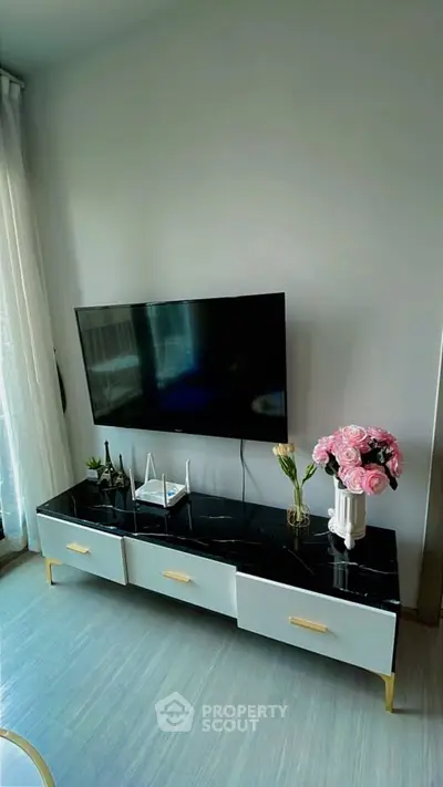Modern living room with sleek TV stand and elegant decor