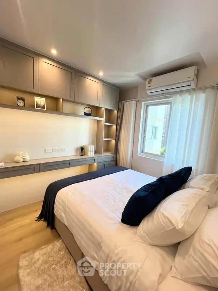 Modern bedroom with built-in storage and natural light