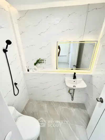 Modern bathroom with sleek fixtures and elegant marble tiles