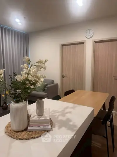 Modern living room with stylish decor and cozy dining area