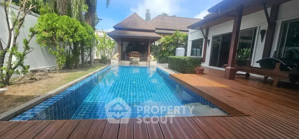 Luxurious villa with private pool and wooden deck in tropical setting