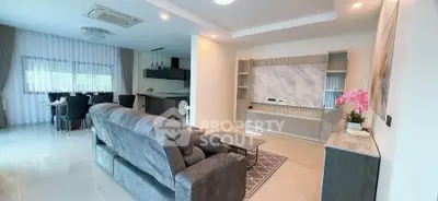 Spacious modern living room with open kitchen and elegant decor