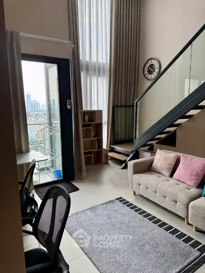 Modern loft apartment with high ceilings and city view from balcony