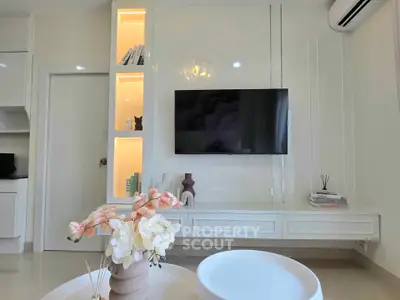 Modern living room with sleek TV setup and elegant decor