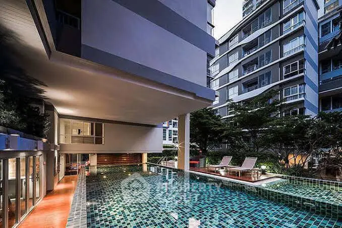 Luxurious condominium with modern pool and stylish architecture