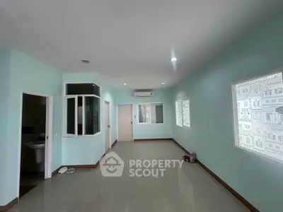 Spacious and bright interior with modern finishes and large windows, perfect for comfortable living.
