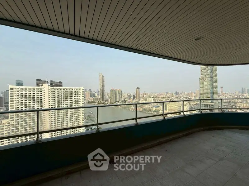 Stunning cityscape view from spacious balcony in high-rise apartment