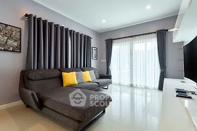Modern living room with sleek gray sofa and stylish decor