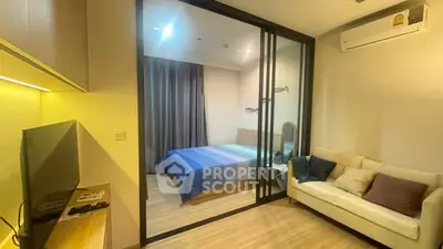 Modern studio apartment with glass partition and cozy furnishings