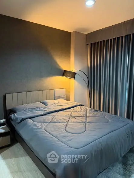 Modern bedroom with stylish decor and cozy lighting