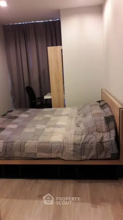 Cozy bedroom with modern decor and comfortable bed in a stylish apartment.